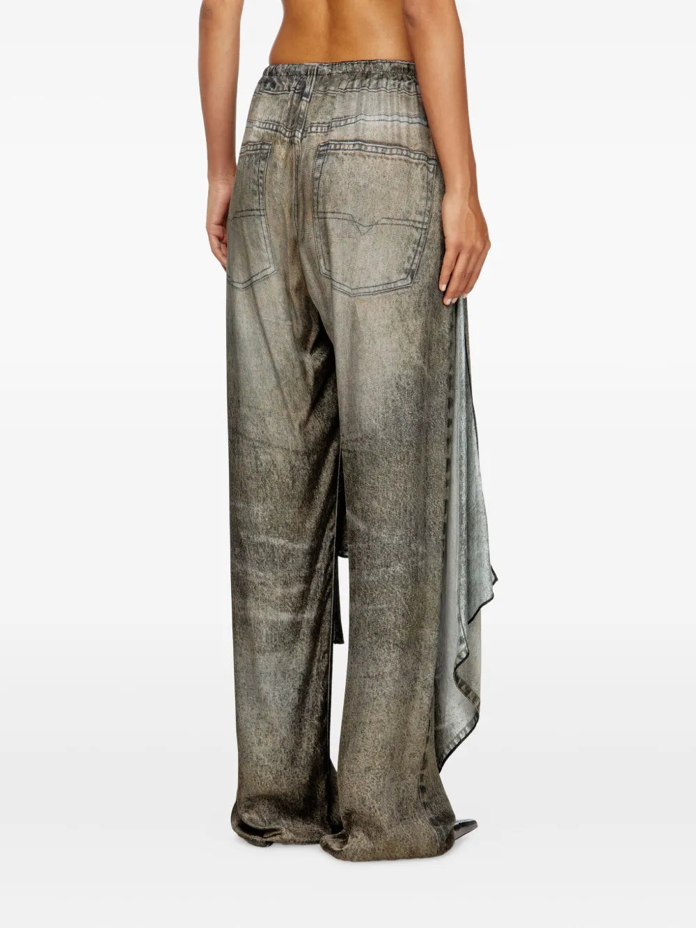 Black pants worn by a person, showing the pants' fit