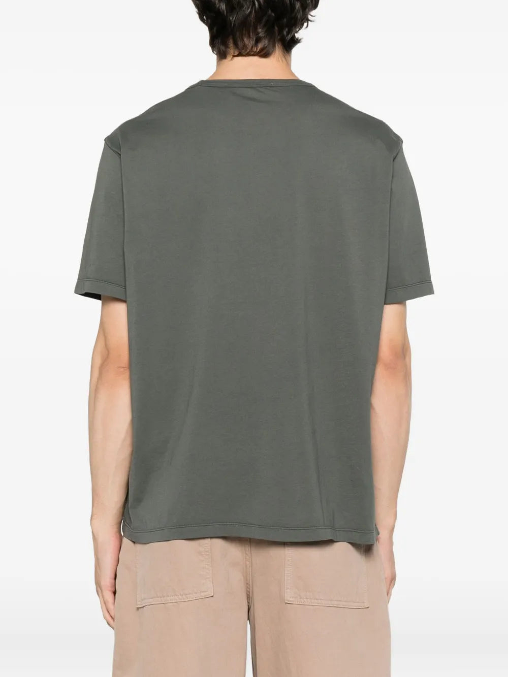 Grey shirt worn by a person, showing the shirt fit