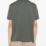 Grey shirt worn by a person, showing the shirt fit