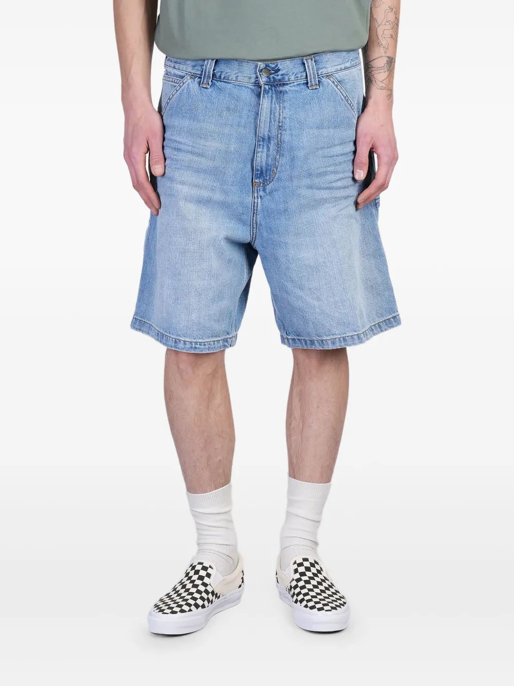 Blue short worn by a person, showing the short's fit