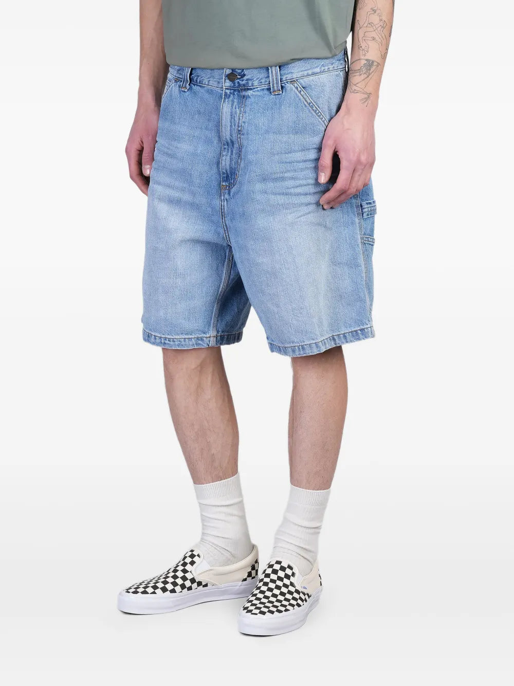 Blue short worn by a person, showing the short's fit