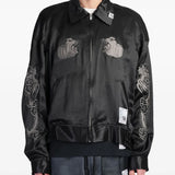 Black jacket worn by a person, showing the jacket's fit