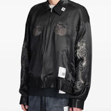 Black jacket worn by a person, showing the jacket's fit