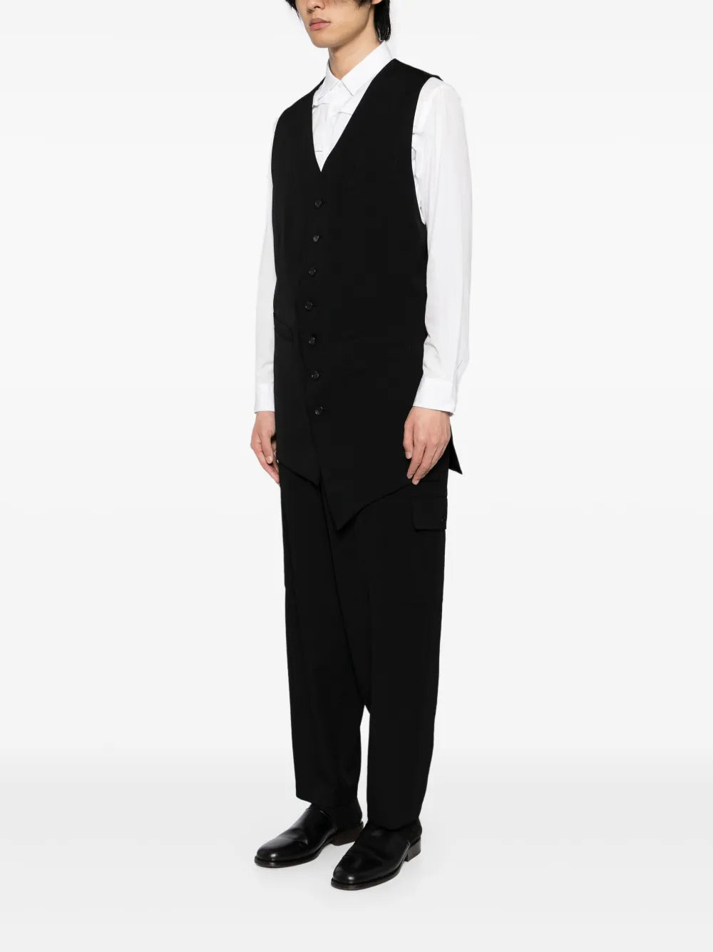 Black vest worn by a person, showing the vest's fit