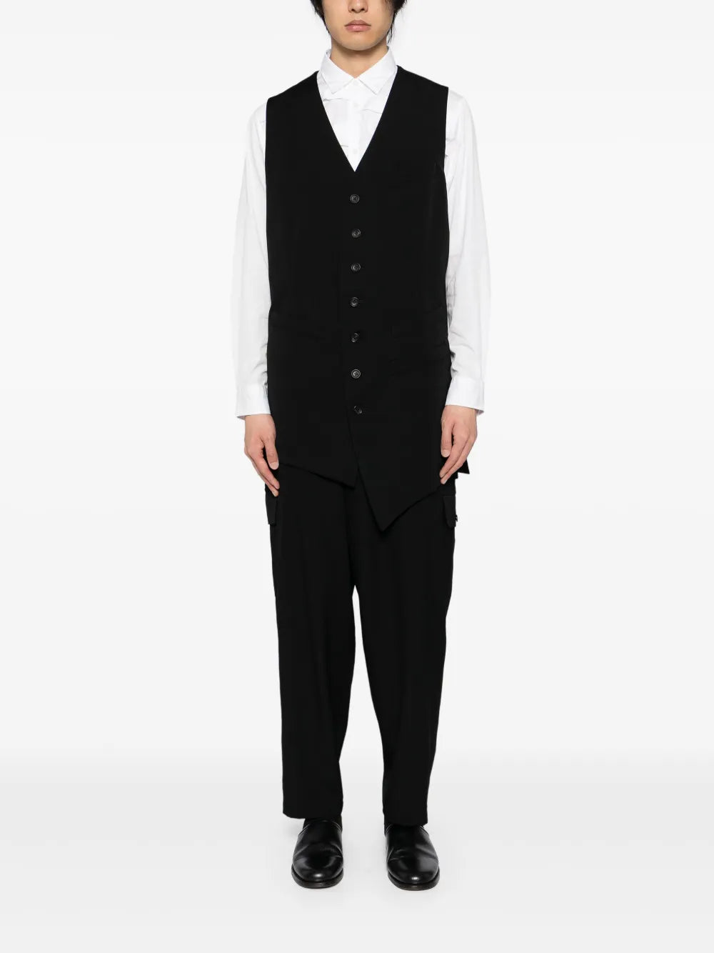 Black vest worn by a person, showing the vest's fit