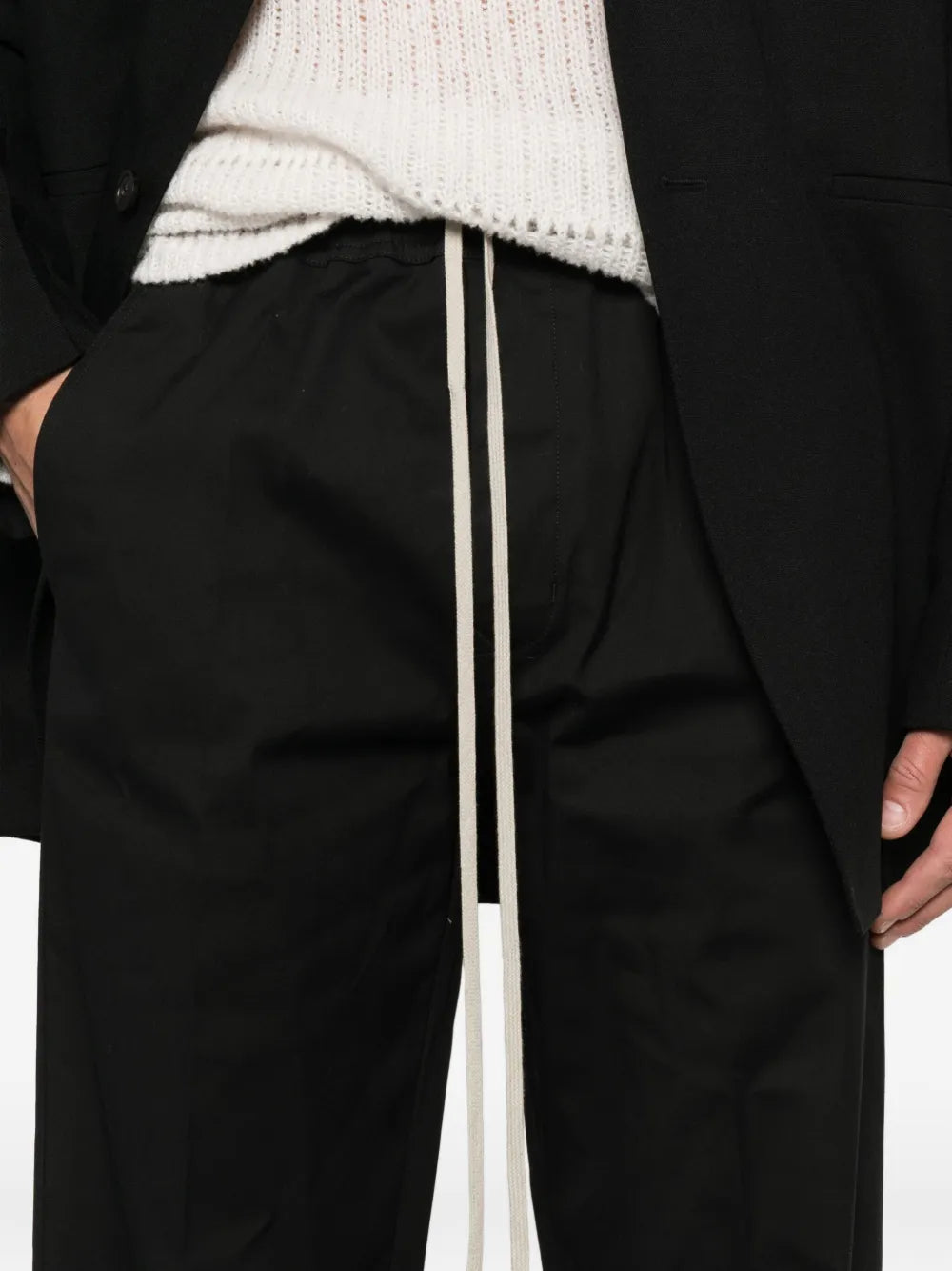 Close up of the black pants, showing texture of the cotton fabric