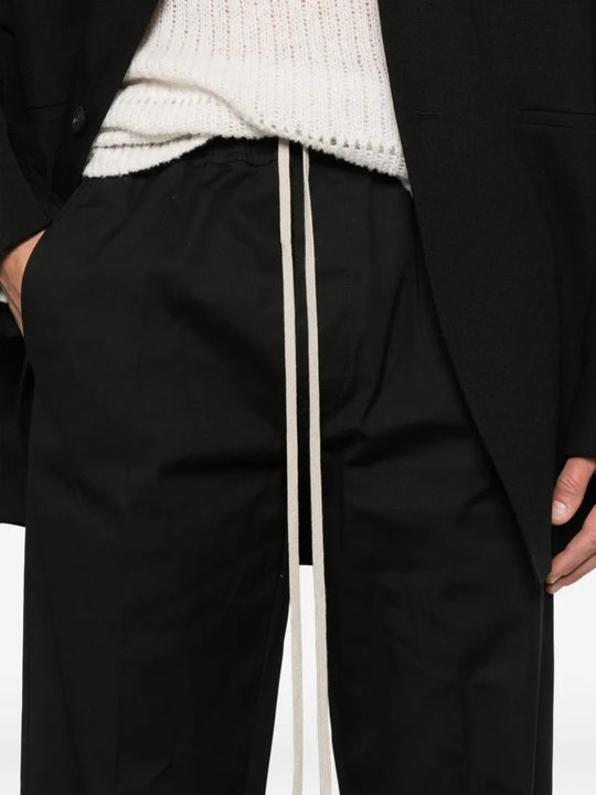 Close up of the black pants, showing texture of the cotton fabric