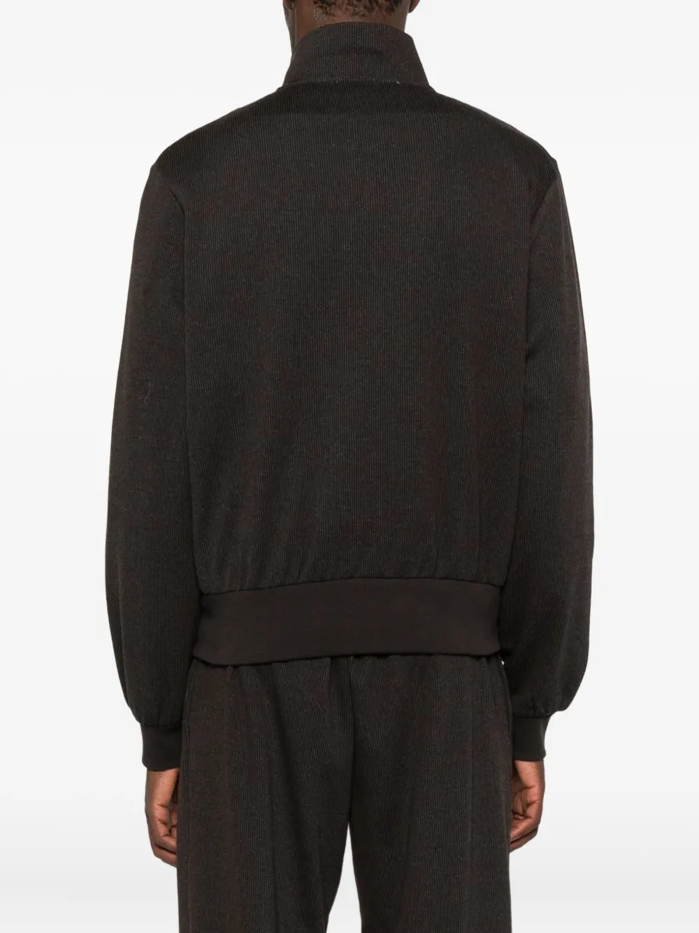 Brown jackets worn by a person, showing the jackets fit