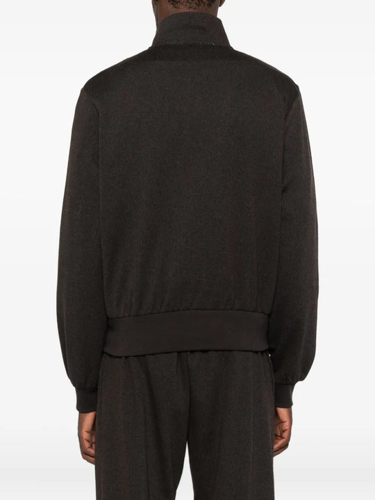 Brown jackets worn by a person, showing the jackets fit