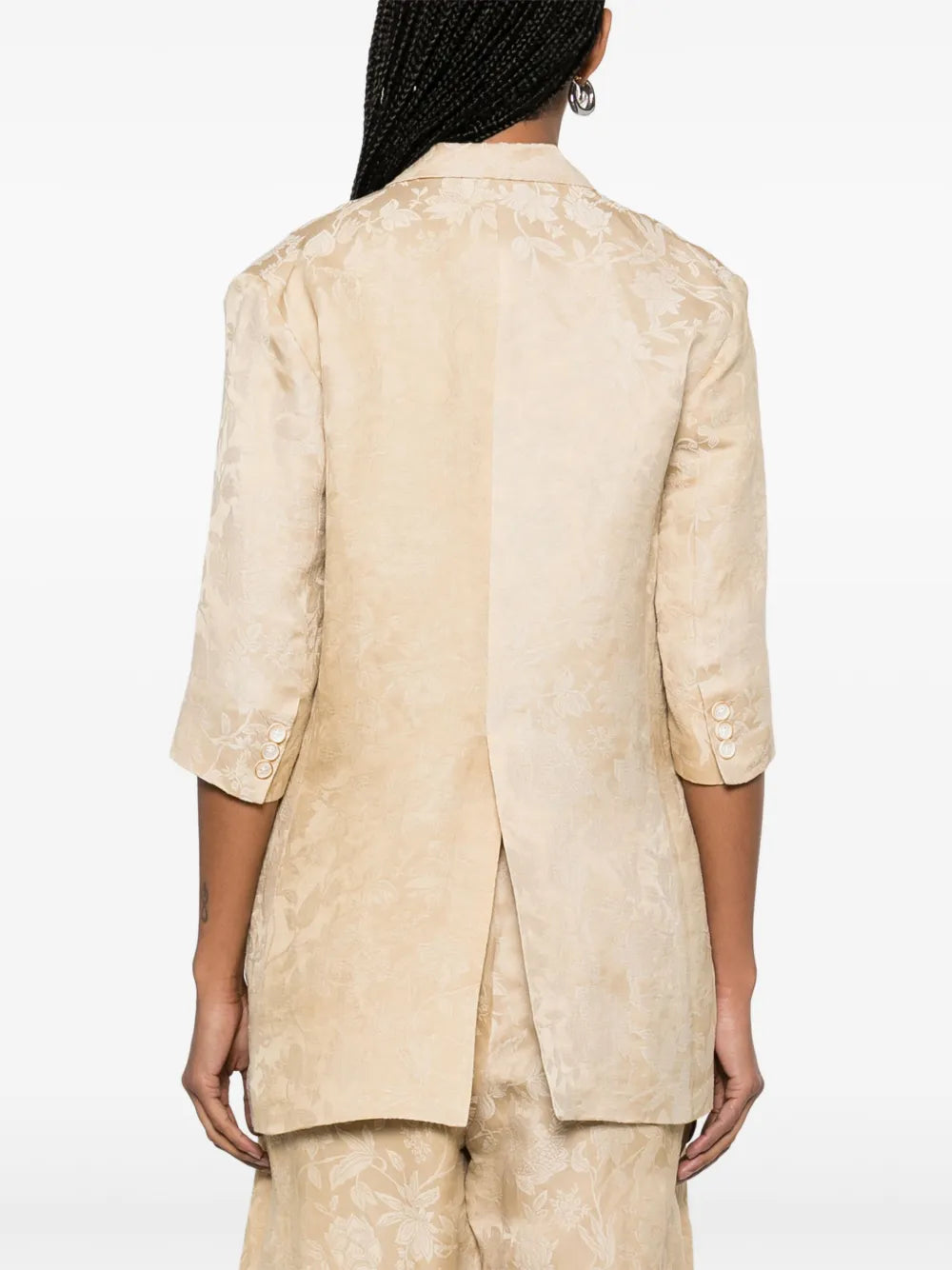 Tan jacket worn by a person, showing the jacket fit