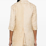 Tan jacket worn by a person, showing the jacket fit