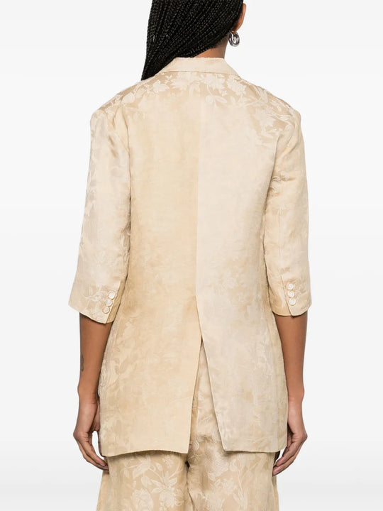 Tan jacket worn by a person, showing the jacket fit