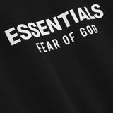 Close up of the black sweatshirt, showing texture of the cotton fabric