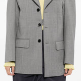Grey jacket worn by a person, showing the jacket's fit