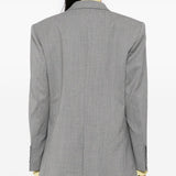 Grey jacket worn by a person, showing the jacket's fit