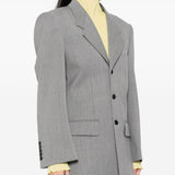 Grey jacket worn by a person, showing the jacket's fit