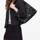 Black bag worn by a person, showing the bag fit