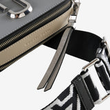 Close up of grey bag, showing texture of the leather fabric