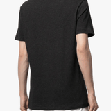 black t-shirt worn by a person, showing the t-shirt fit