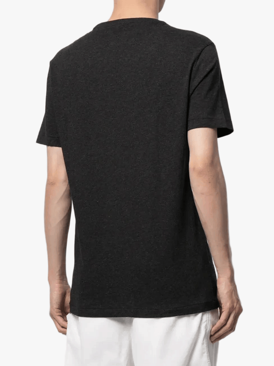 black t-shirt worn by a person, showing the t-shirt fit