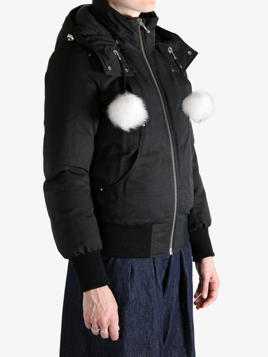 Black jacket worn by a person, showing the jacket's fit