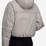 Pink jacket worn by a person, showing the shirt's fit