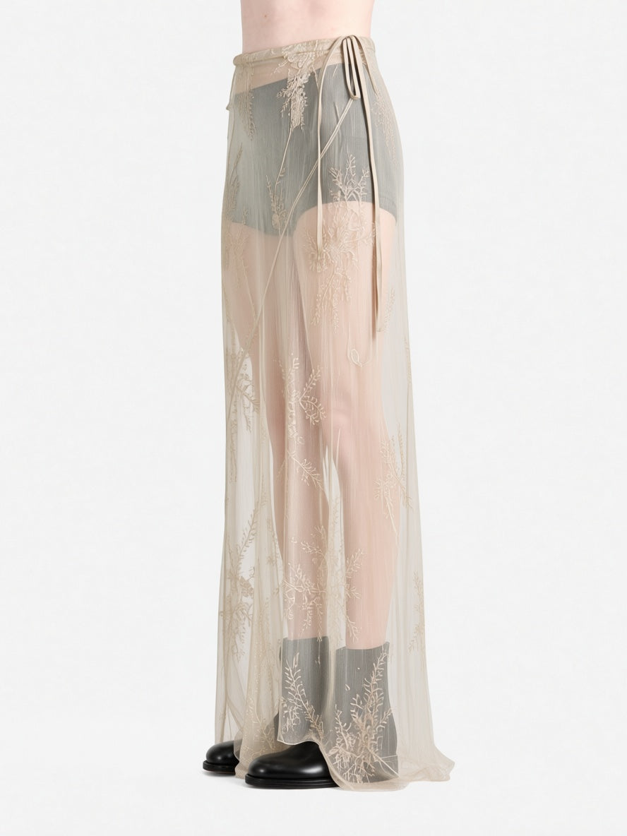 tan skirt worn by a person, showing the skirt  fit