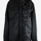 Black jacket worn by a person, showing the jacket's fit