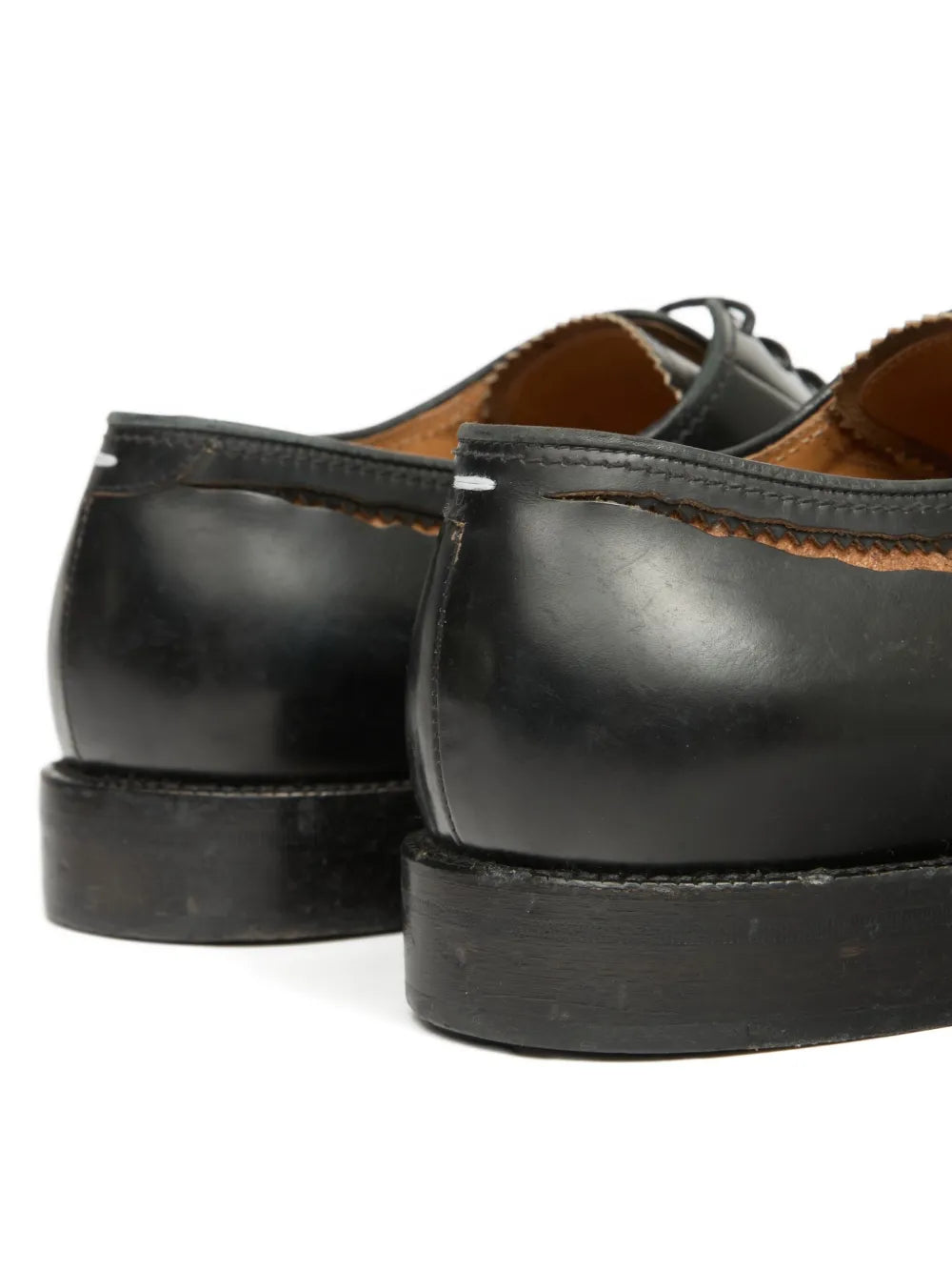 Close up of black shoes, showing texture of the leather fabric