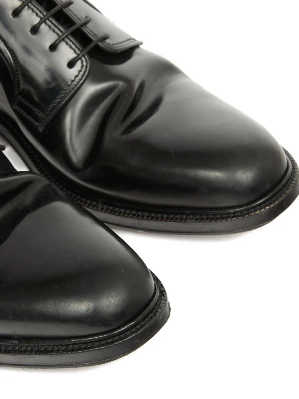 Close up of black shoes, showing texture of the leather fabric