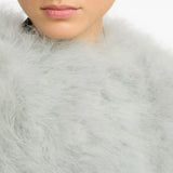 Close up of grey coat, showing texture of the feather fabric