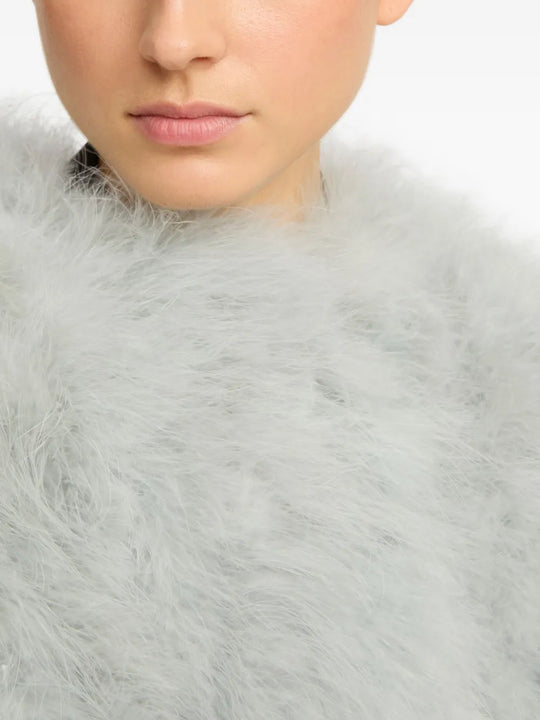 Close up of grey coat, showing texture of the feather fabric