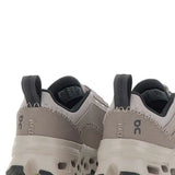 Close up of the grey sneakers, showing texture of the recycled polyester fabric