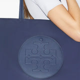 Blue bags worn by a person, showing the bags fit