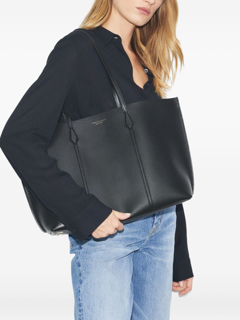 Black bags worn by a person, showing the bags fit