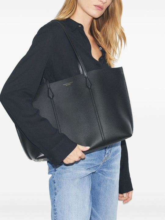 Black bags worn by a person, showing the bags fit
