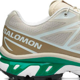 Close up of tan shoes, showing texture of the mesh fabric