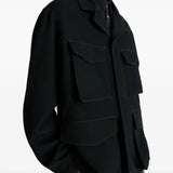 Navy jacket worn by a person, showing the jacket  fit