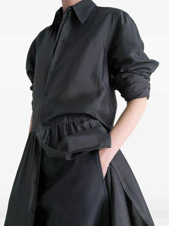 Close up of black dresses, showing texture of the silk fabric