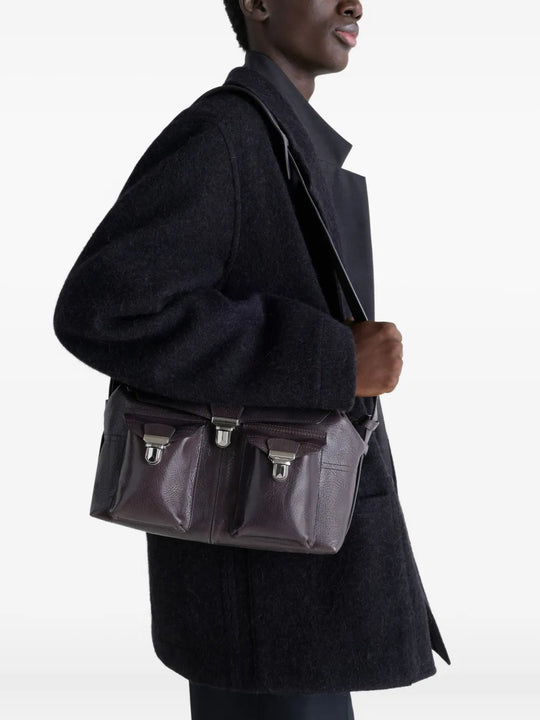 Purple bag worn by a person, showing the bag's fit