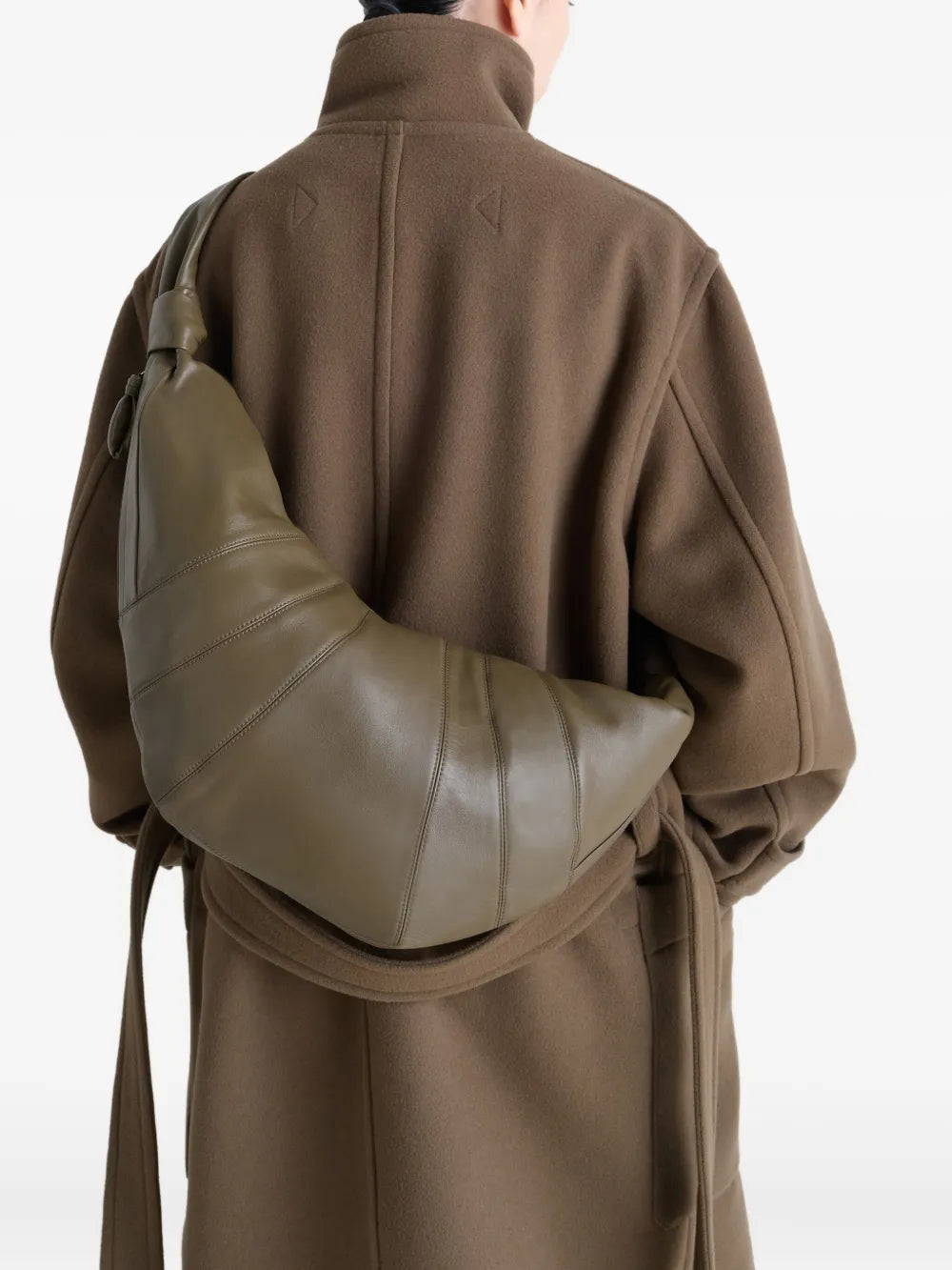 Green bag worn by a person, showing the bag's fit