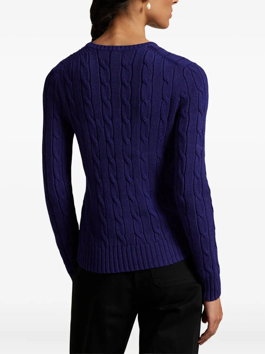Blue pullover worn by a person, showing the pullover's fit