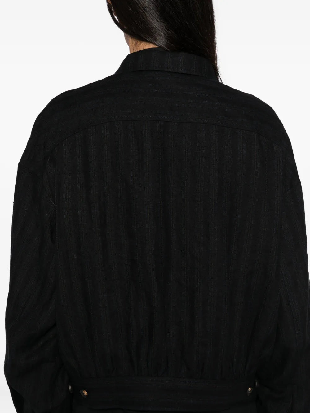 Close up of the black jacket, showing texture of the linen fabric