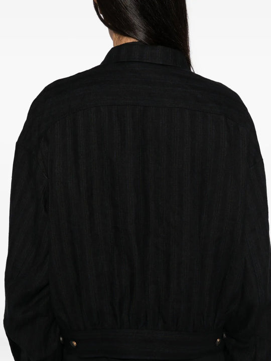 Close up of the black jacket, showing texture of the linen fabric