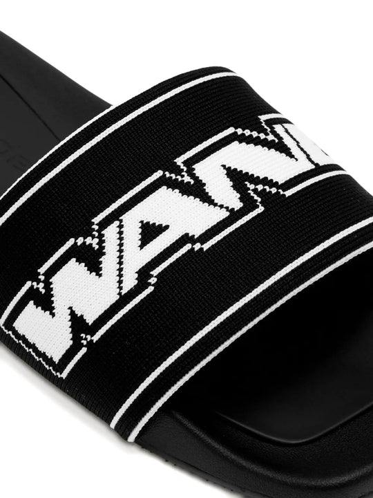 Close up of the black mule, showing texture of the polyester and nylon fabric