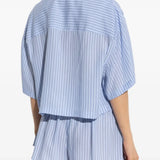 Blue shorts worn by a person, showing the shorts's fit