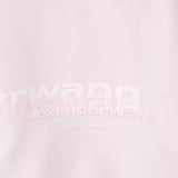 Close up of the pink t-shirt, showing texture of the cotton fabric