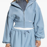 Blue hoodie worn by a person, showing the hoodie fit