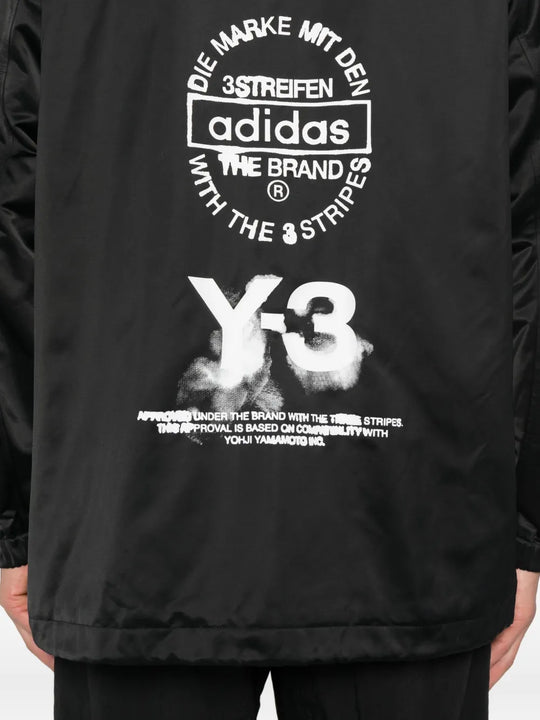 Close up of black jacket,showing texture of the recycled polyacrylic fabric.