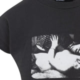 Close up of black T-shirt, showing the texture of cotton fabric